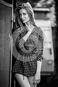 Black-white outdoors portrait of beautiful young blond woman