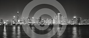 Black and white panoramic picture of Chicago city skyline at night.