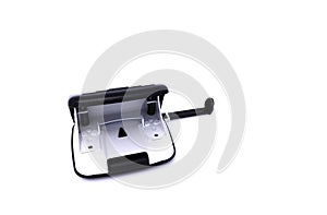 Black and white paper hole puncher, isolated on white background