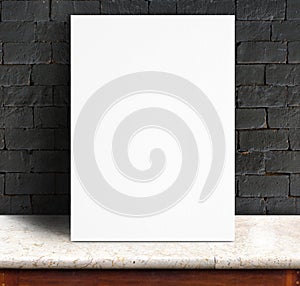 Black White paper poster lean at black brick wall and marble tab