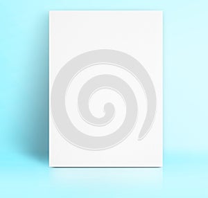 Black White paper poster lean at pastel blue color studio room,Template mock up for adding your text