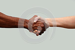 Black and white people holding hands together