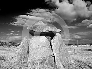 Black and white photo of the Anta da Vidigueira, a megalithic dolmen in the Alentejo region of Portugal