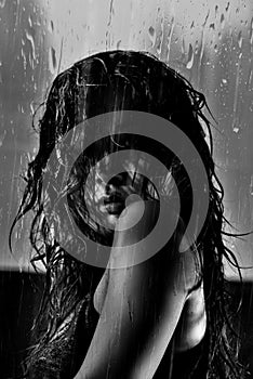 Black and white photo of Asian model with wet hair and drops of water on face