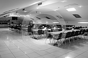 Black and white photo of clean and luxurious dining room and buffet