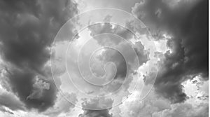 a black and white photo of clouds in the sky generated