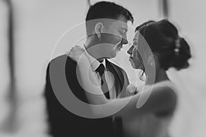 Black white photo couple groom and bride against the background studio