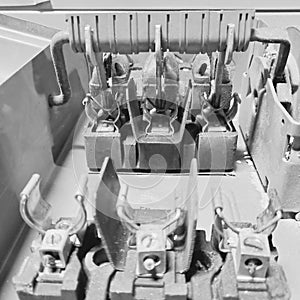 Black and white photo of electrical disconnect internals without fuses