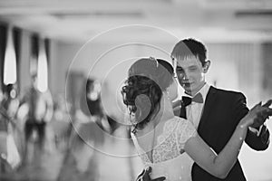 Black and white photo first dance the bride groom in the smoke
