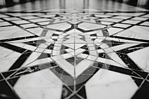 A black and white photo of a floor with a star pattern