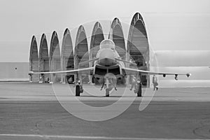 Black and white photo of head on view of Typhoon 938 taxiing at RAF Coningsby - stock photo
