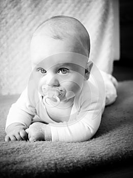 Black-and-white photo of infant baby during timmy time photo