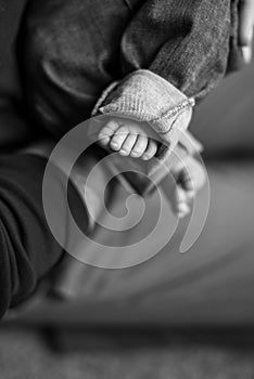 Black and White Photo of a Man Holding a Baby