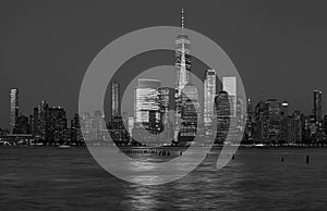 Black and white photo of Manhattan skyline at night, New York City, USA