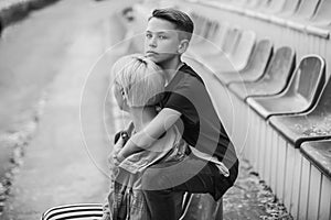 black and white photo of mother and son hugging