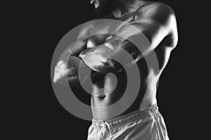 Black and white photo of muscular african athlete body