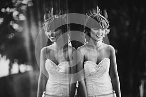 Black and white photo with the noise of a beautiful cheerful young bride in a luxury white dress. displaying the bride in the