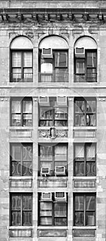 Black and white photo of an old townhouse facade, New York City, USA