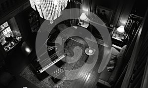 Black and white photo of a piano in the interior of a room
