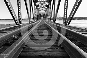 Black and white photo of railway bridge.