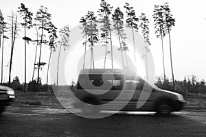 Black and white photo in retro style with car on palms background