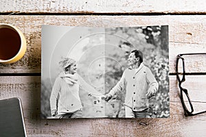 Black-and-white photo of senior couple in autumn nature, studio