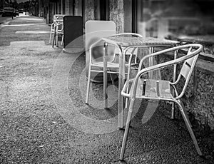 Black and white photo of silver chrome non corrosive chairs with matching table