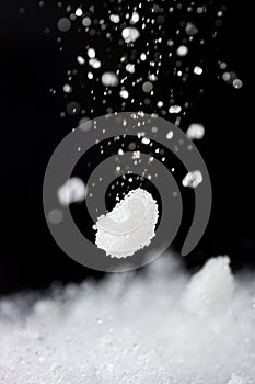 A black and white photo of a snow falling from the sky