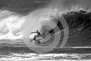 Black and White Photo of a Surfer Surfing