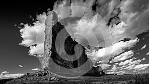 Black and White Photo of tall and fragile sandstone Rock Fin names the Tower of Babel in Arches National Park