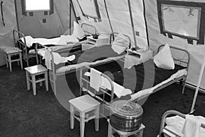 Black and white photo of a tent military hospital during the Second World War