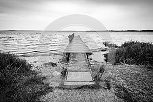 Black and white photo of a wooden pier