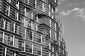 Black and white photograph of a building, lots of windows