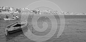 A black and white photograph depicting a view of the ghats of river Ganga at Varanasi, India. photo