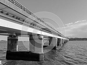 A black and white photograph of the Tay Road Bridge, spanning South from Dundee to Newport-On-Tay