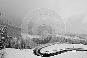 Black-and-white photographs of ski slopes and lifts in winter the snowy slopes of the mountains during a snowfall