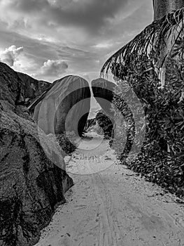 Black and White Photography of an Amazing tropical beach Anse Source d`Argent with granite boulders at sunset, La Digue Island,