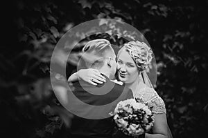 Black white photography beautiful young couple stand on background forest