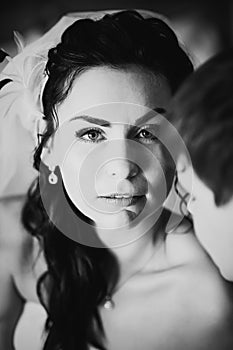 Black white photography beautiful young couple standing near the window