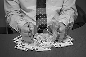 Black and white photography criminal hands locked in handcuffs. Close-up view