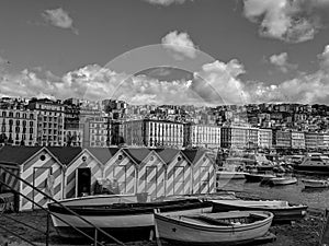 Black and White Photography of Naples bay and fishing boats on the Mediterranean sea shore. Italy. Seascape