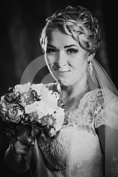 Black white photography portrait of bride on the classic dark background