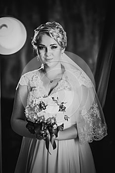 Black white photography portrait of bride on the classic dark background