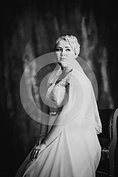 Black white photography portrait of bride on the classic dark background