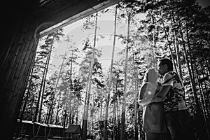 Black white photography romantic young couple kissing on background summer forest