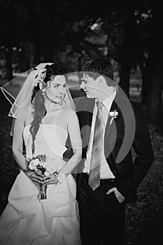 Black white photography wedding beautiful young couple stand on background forest