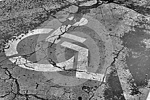 black and white picture of a dilapidated disabled parking space