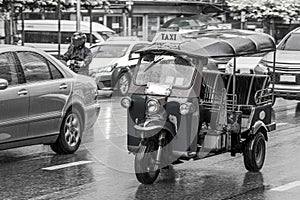 Black and white picture of driving tuk tuk Bangkok Thailand