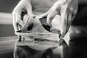 Person Shuffling a Deck of Cards