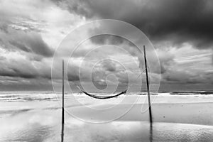 Black and white picture of Romantic cozy hammocks in the sea, Peaceful seascape. Relax, travel concept, travelling. Copy space